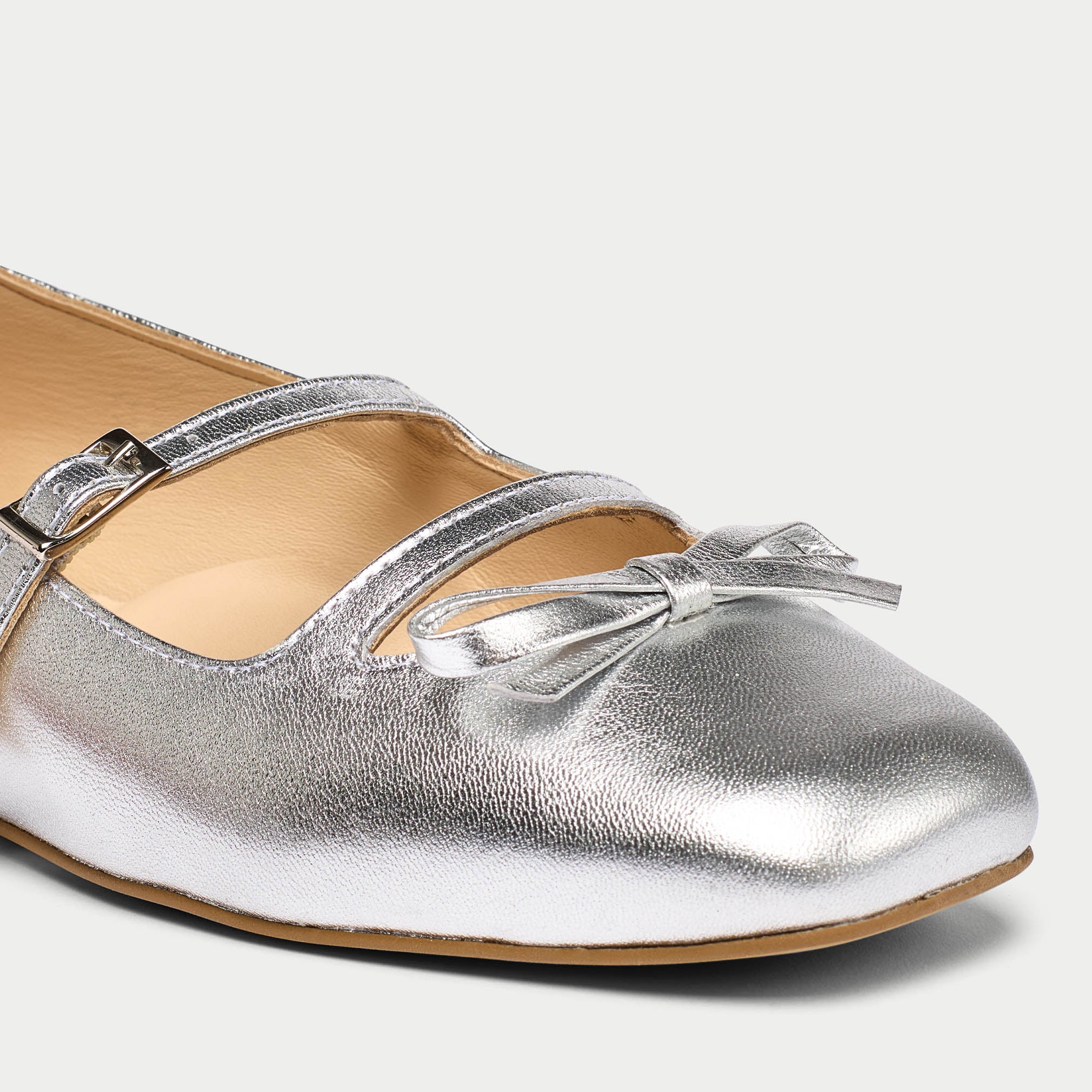 Alexa close-up silver flats tip view