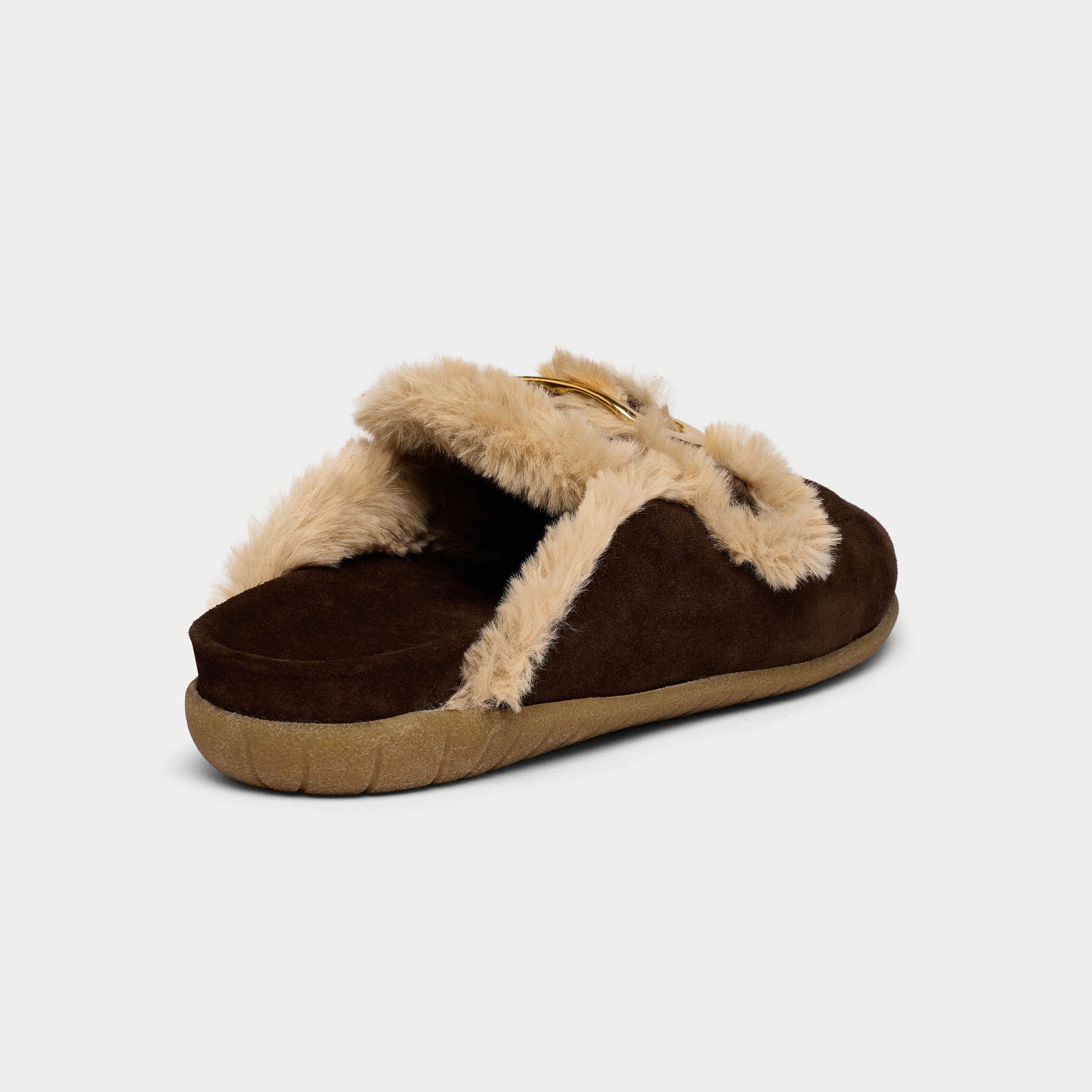 Brown slipper with beige fur trim on a light gray background