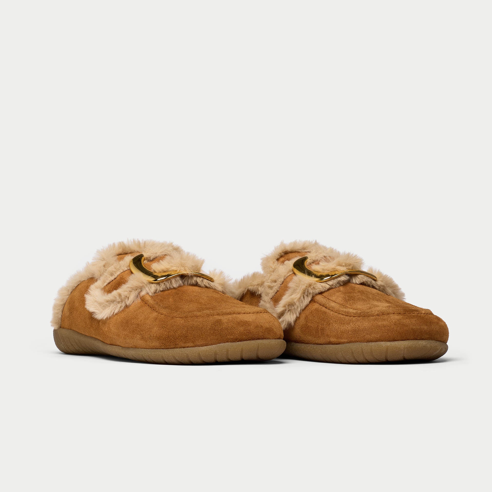 Pair of brown slippers with fur trim on a white background