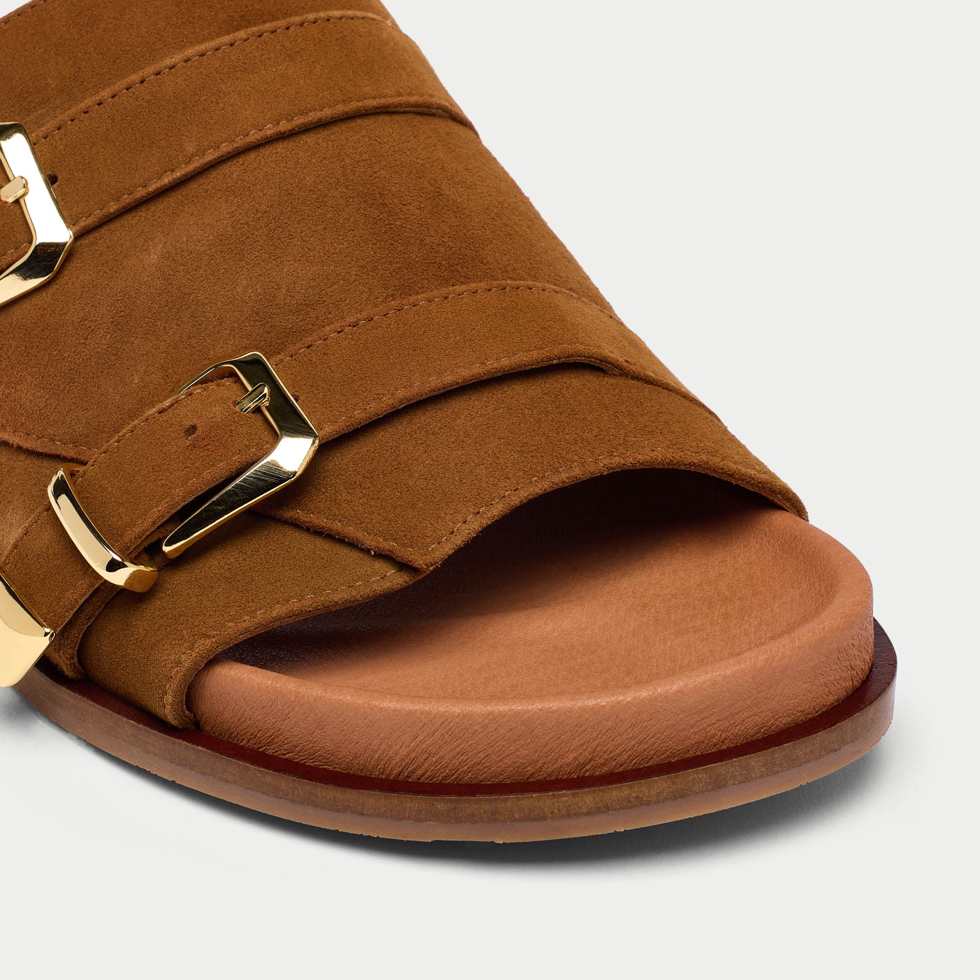 close up of tan suede sandals