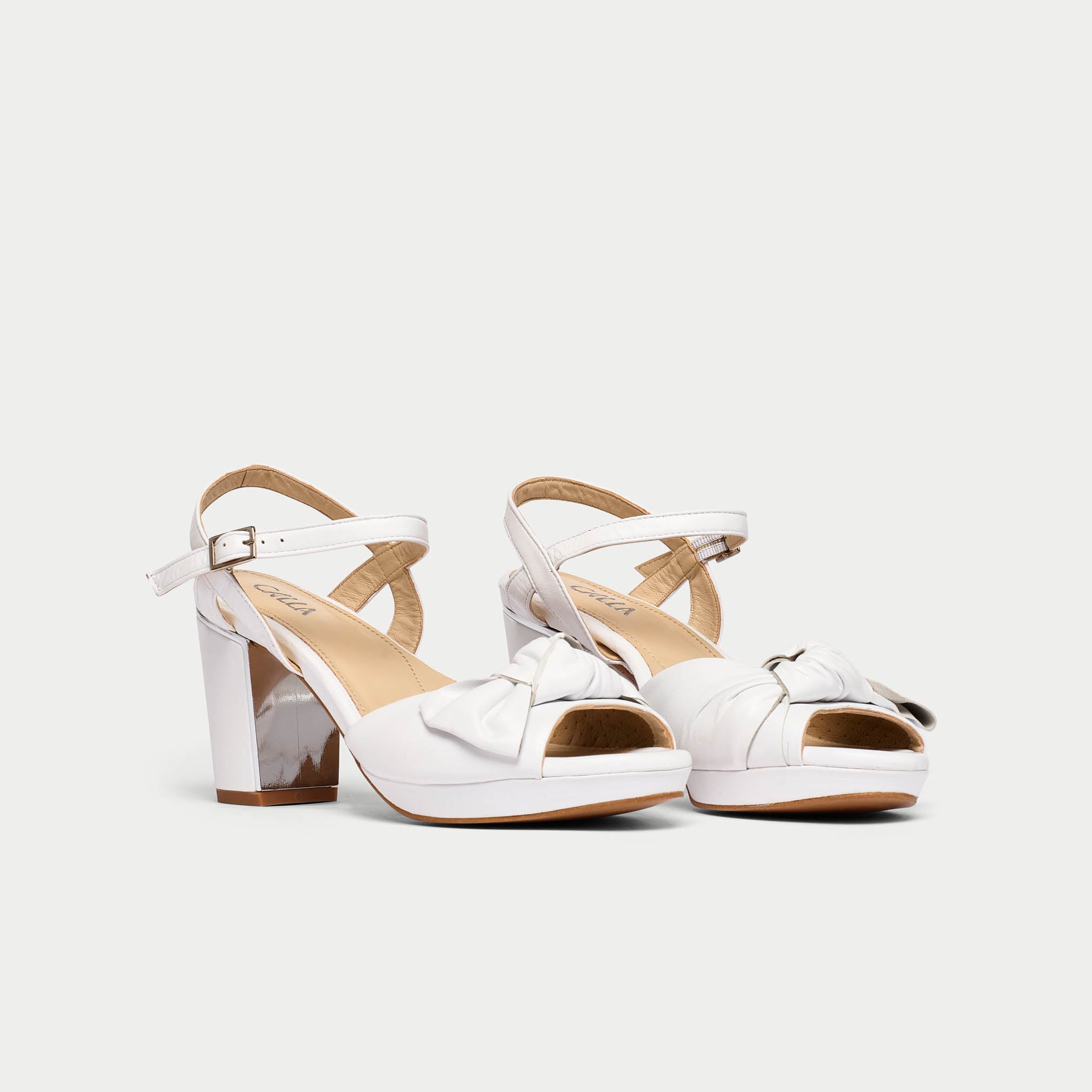 Lizzie white sandal heel pair