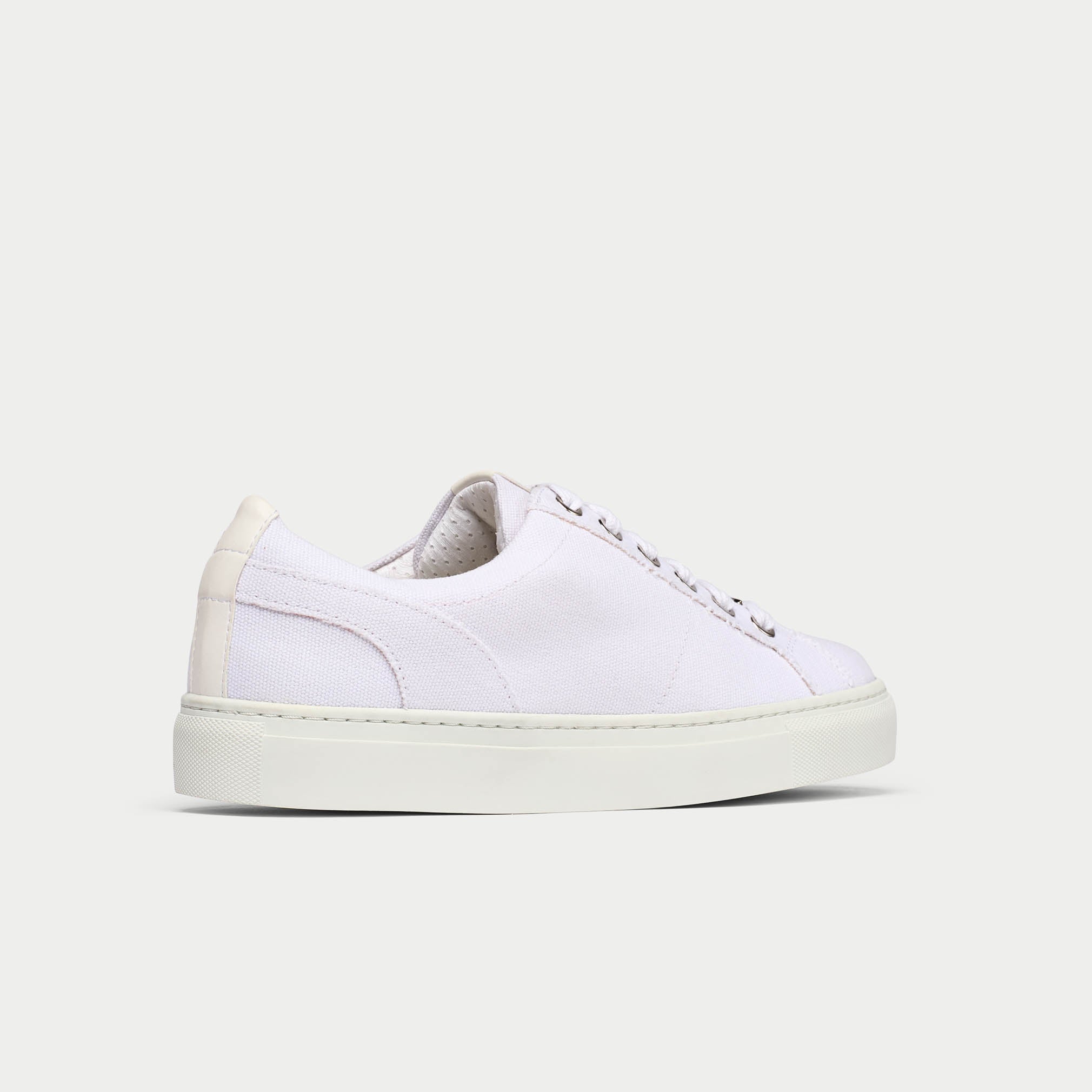 Luna white trainer shoe back/side view