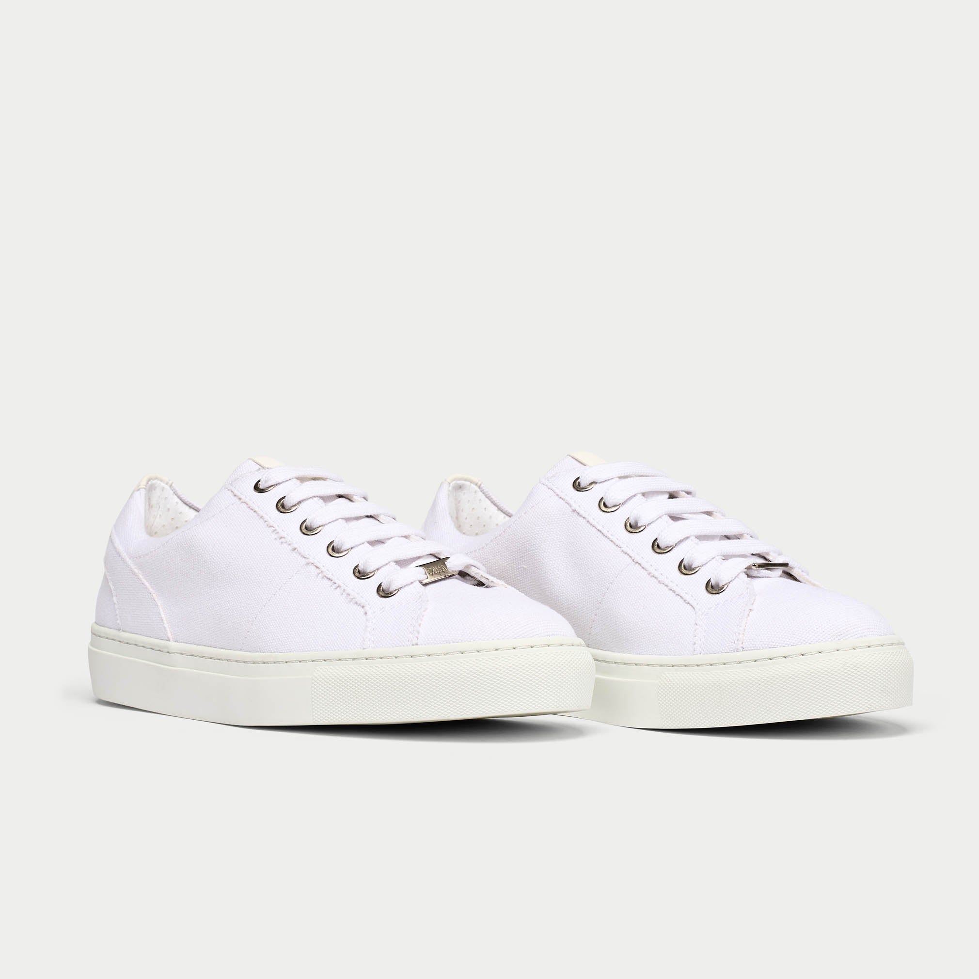 Luna white trainer shoe pair