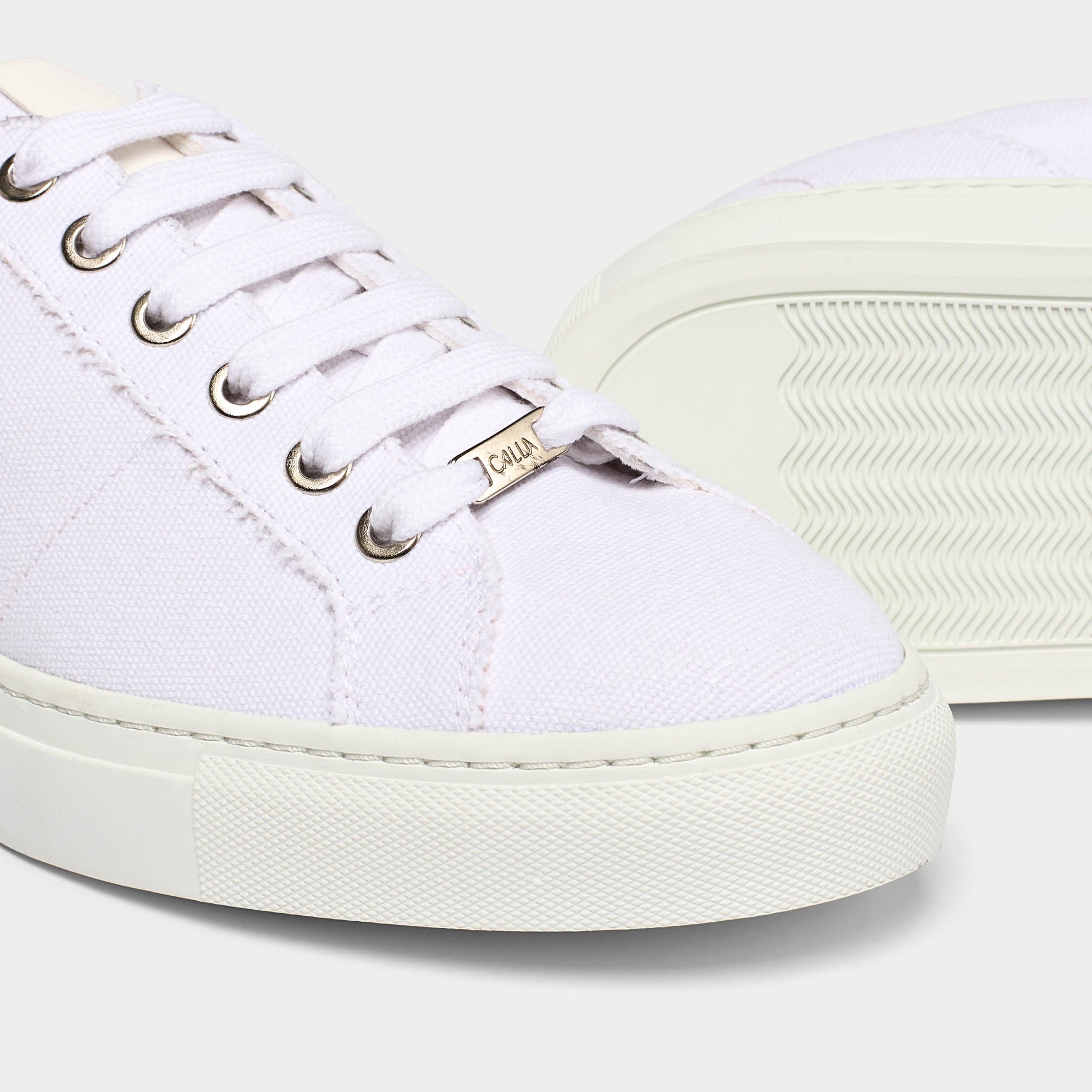 Luna white trainer shoe tip close up