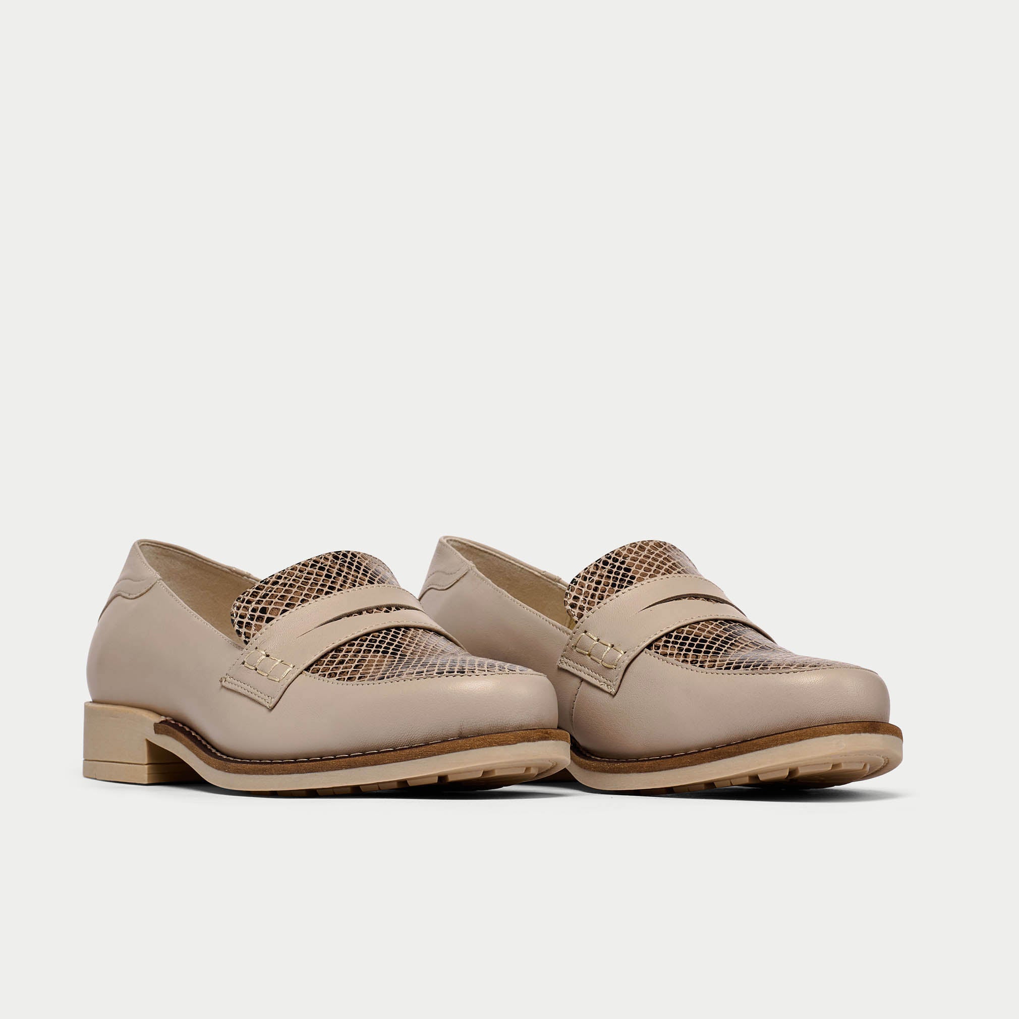 pair of snake print loafers