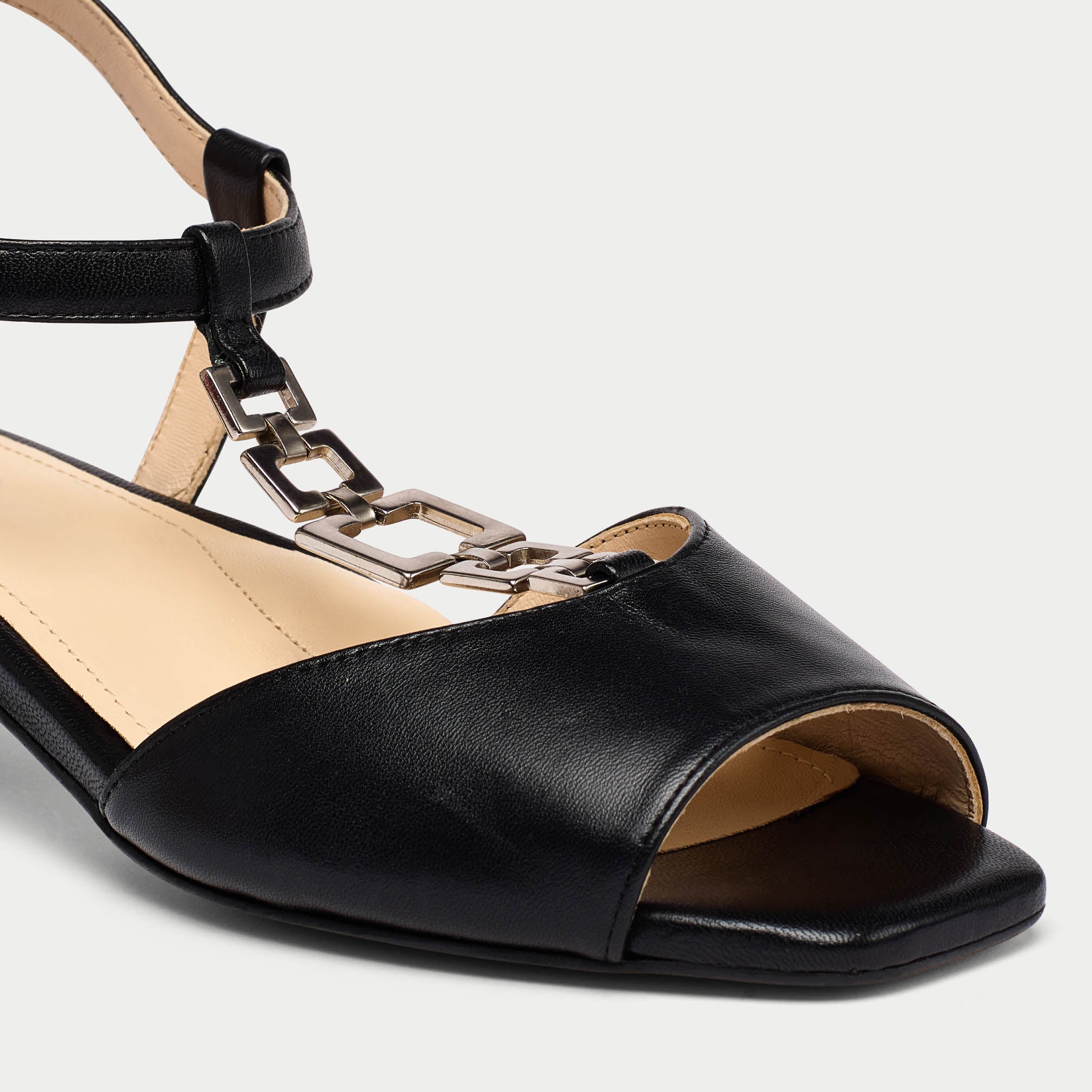 Naomi black leather sandal tip close up