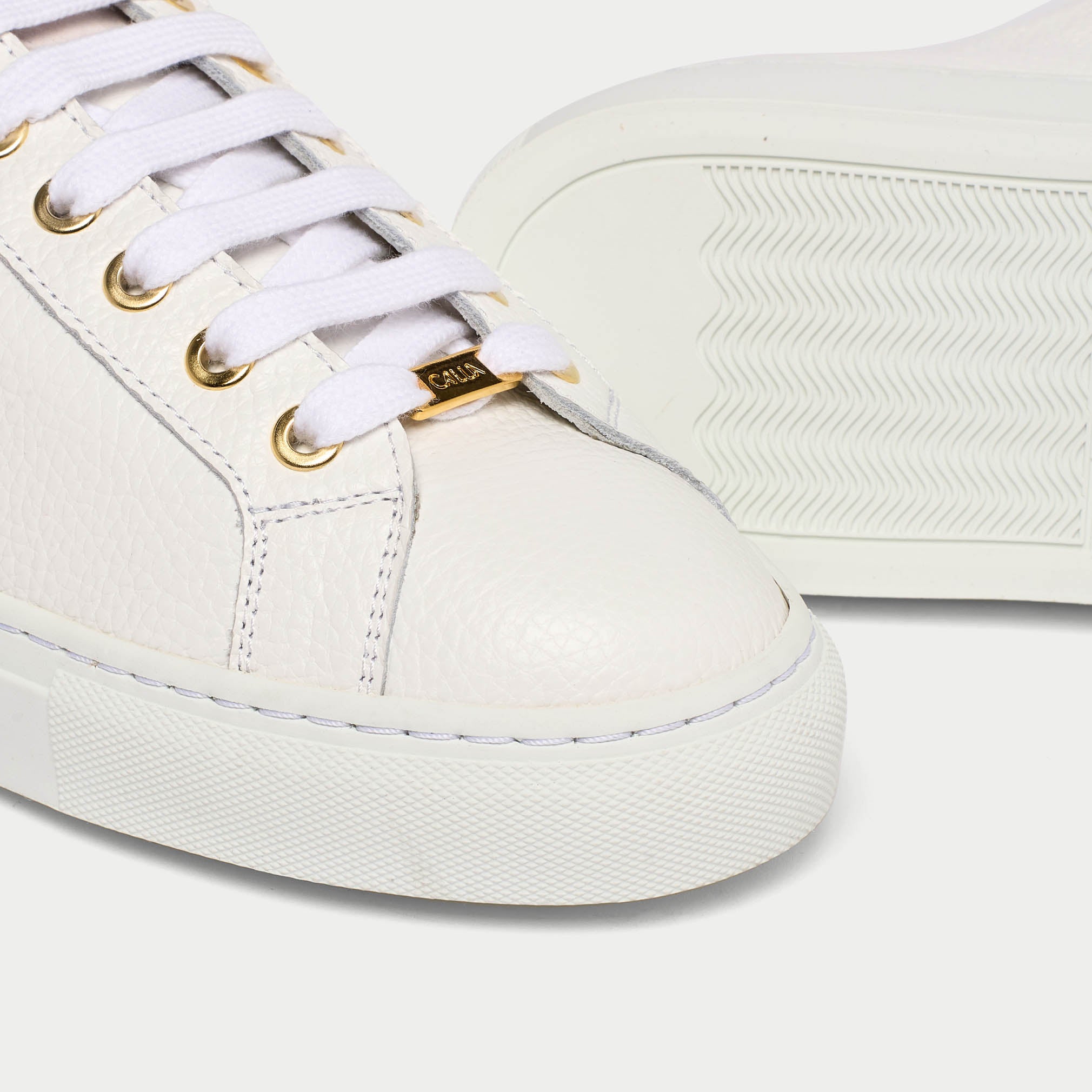 Star white leather sneaker tip close up
