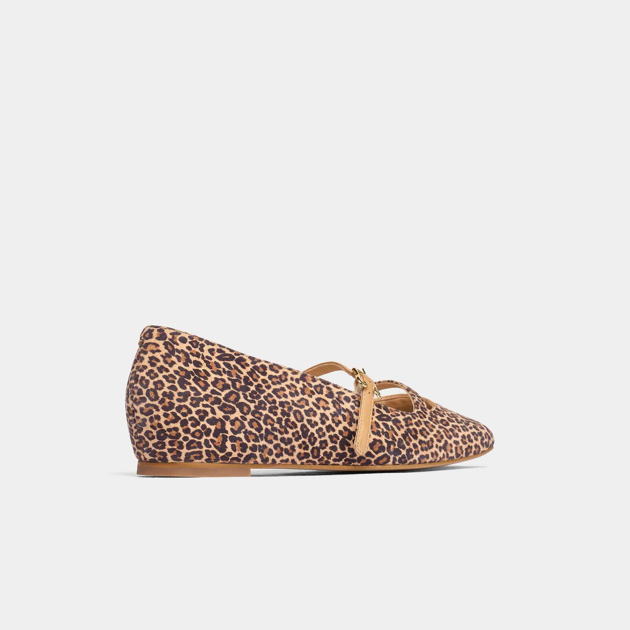 Leopard print flat shoe with a bow on a light gray background