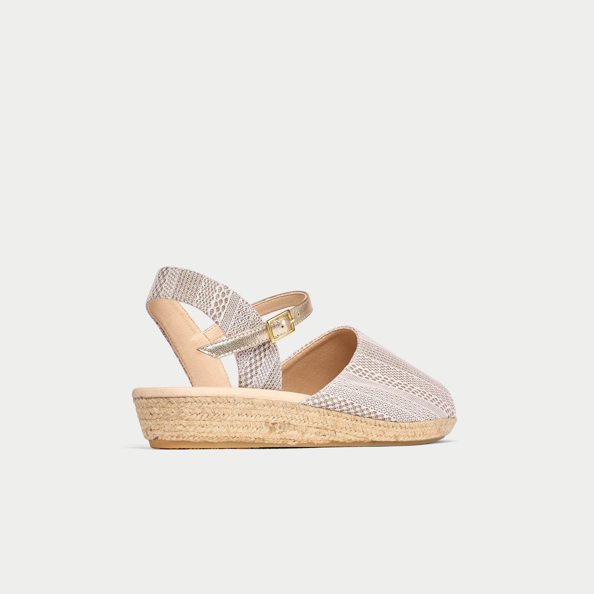 Silver wedge sandal on a light gray background