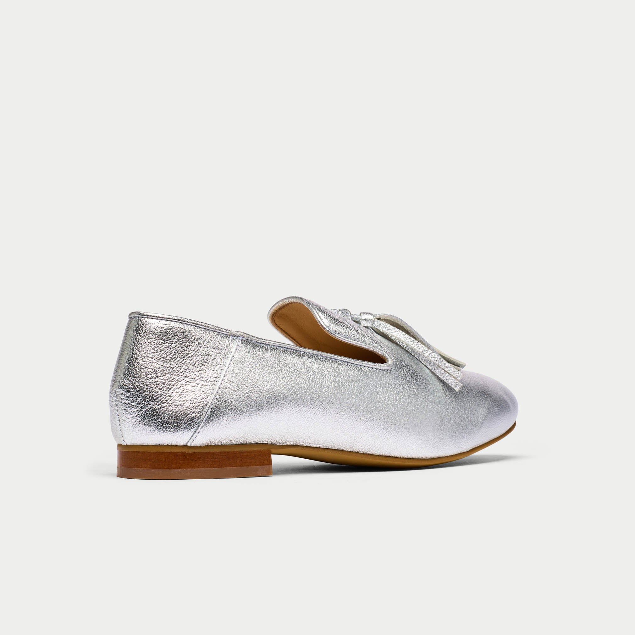 Silver loafer shoe on a white background