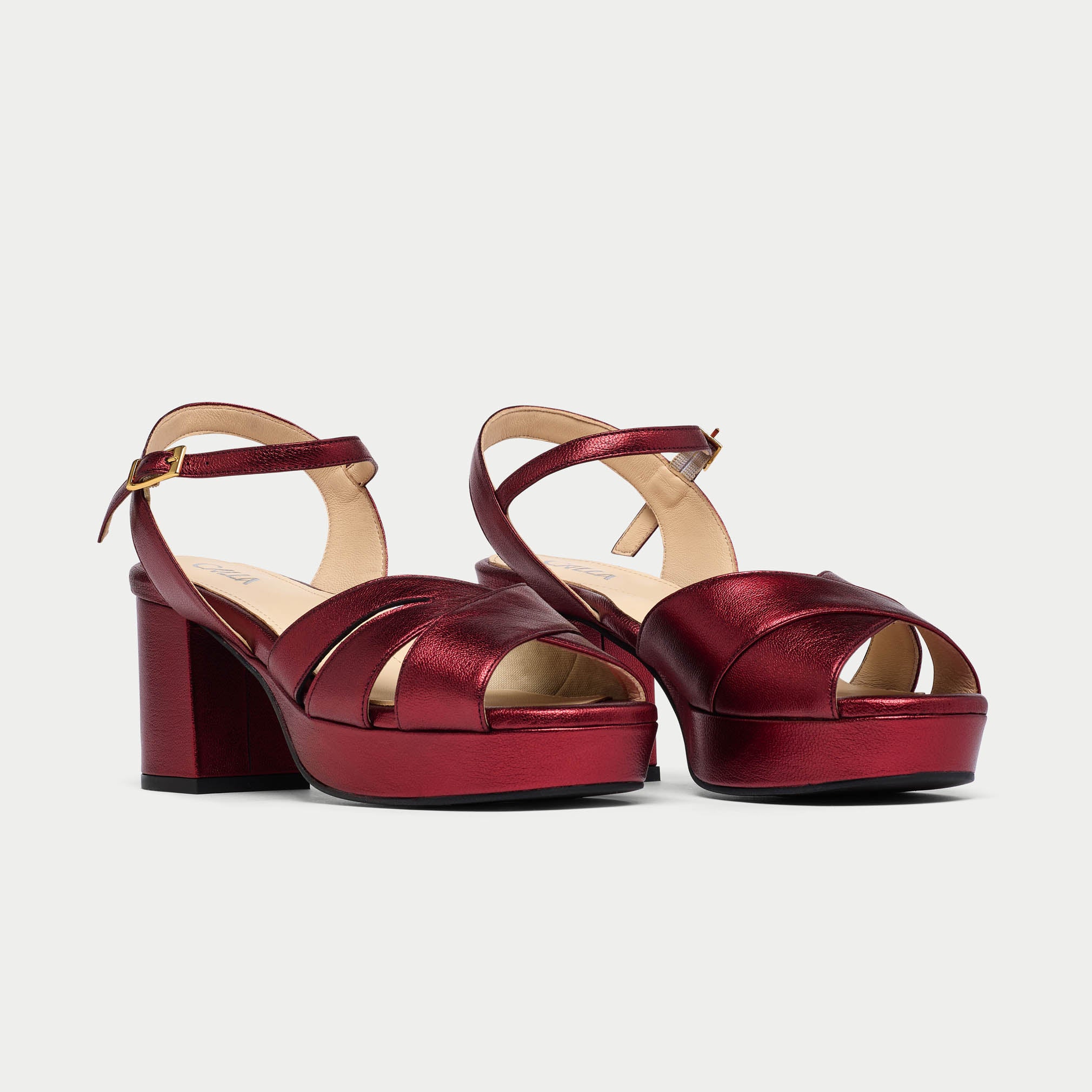 Red platform sandals on a light gray background