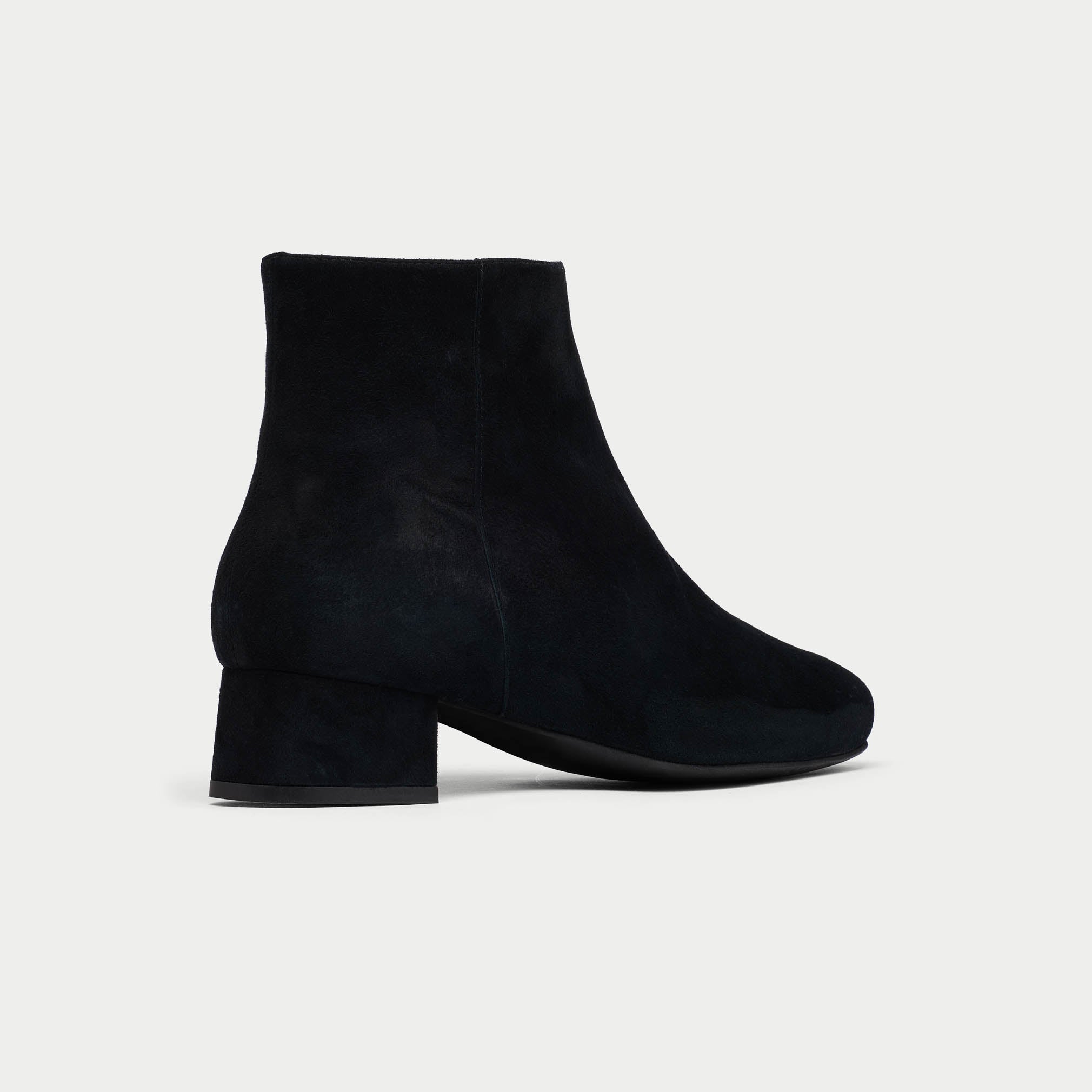 Black Lexie ankle boots on a light gray background