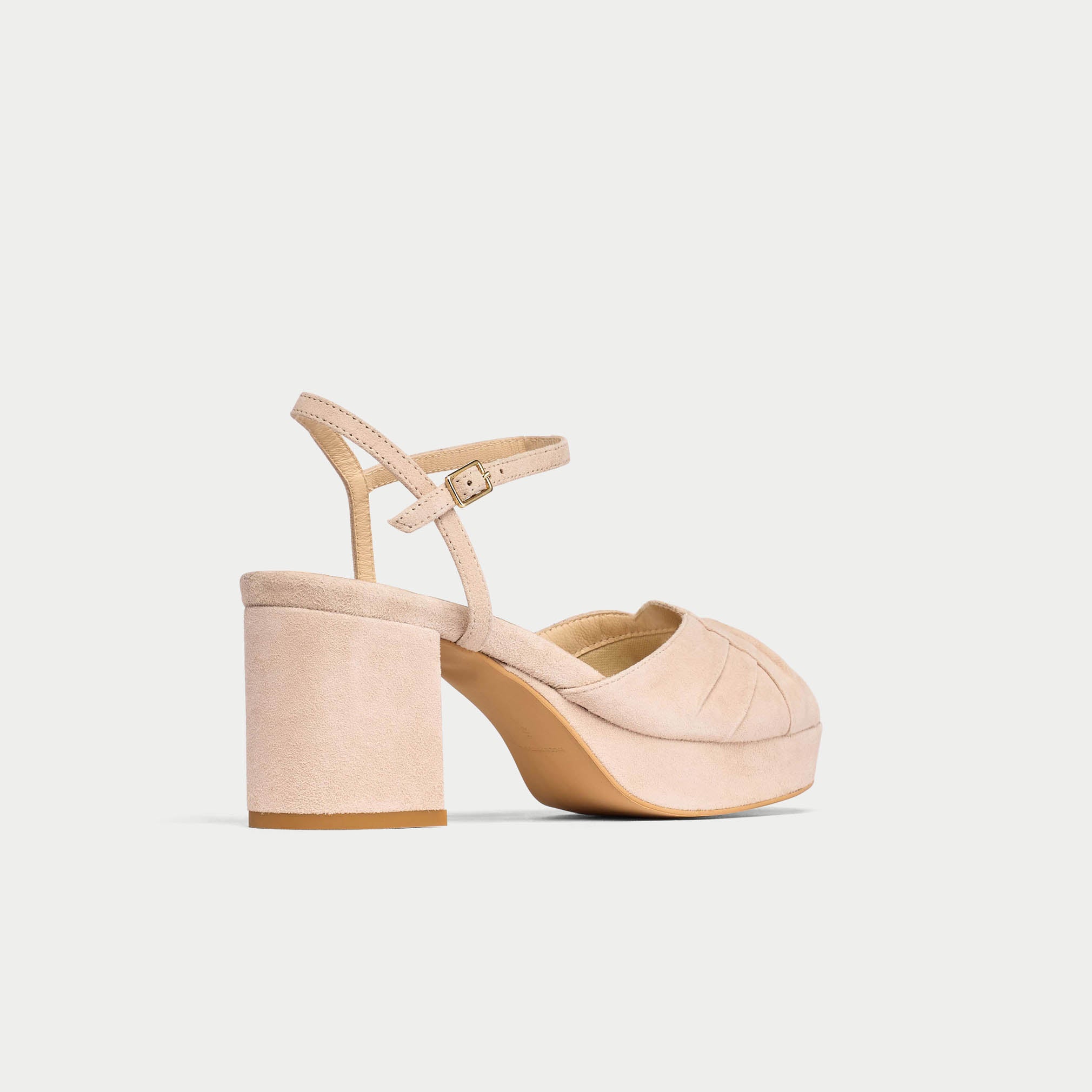 Beige high-heeled sandal on a light gray background