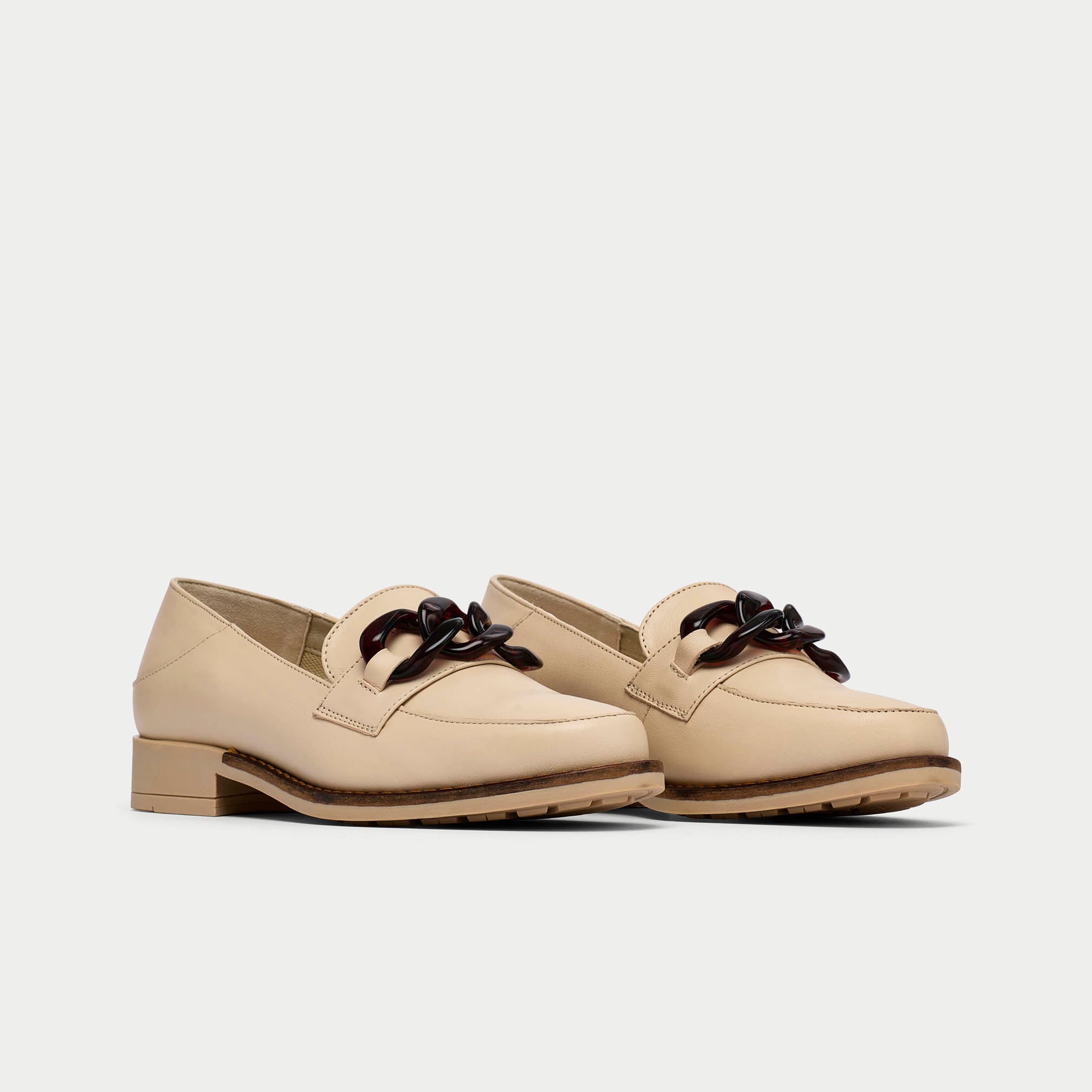 pair of neutral leather loafers