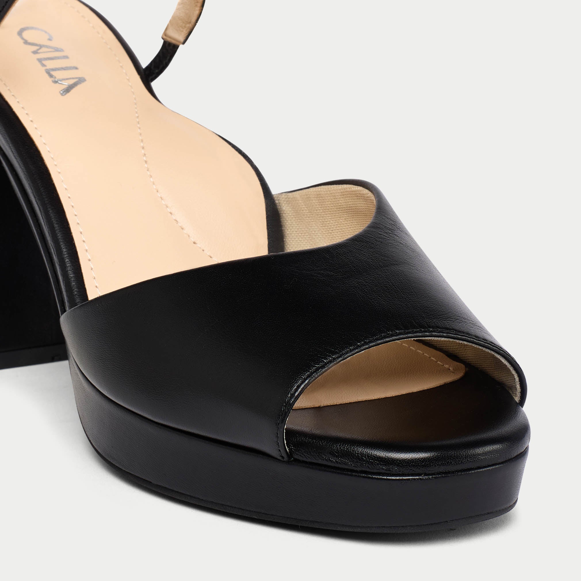 Black open-toe sandal on a white background