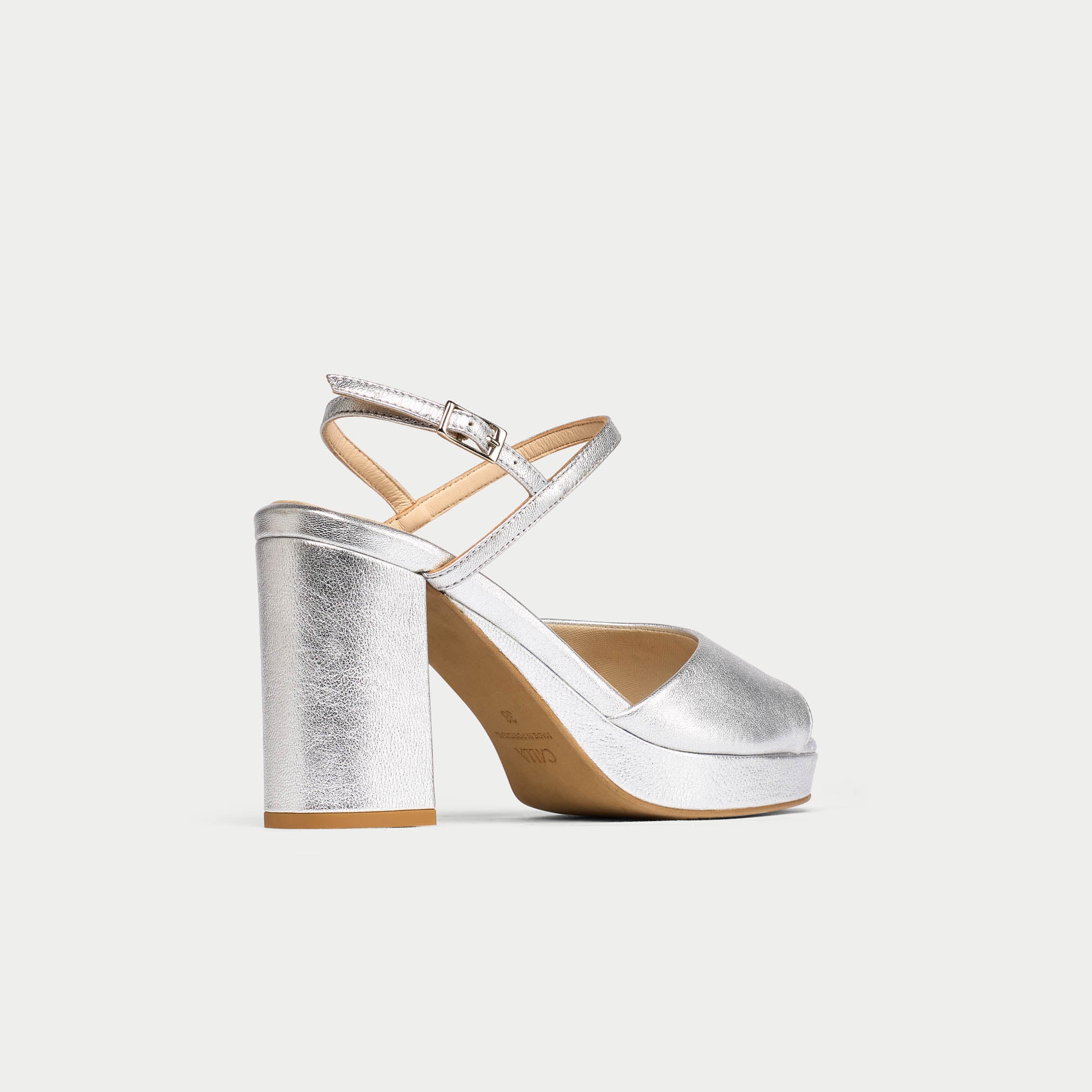 Silver high-heeled sandal on a white background