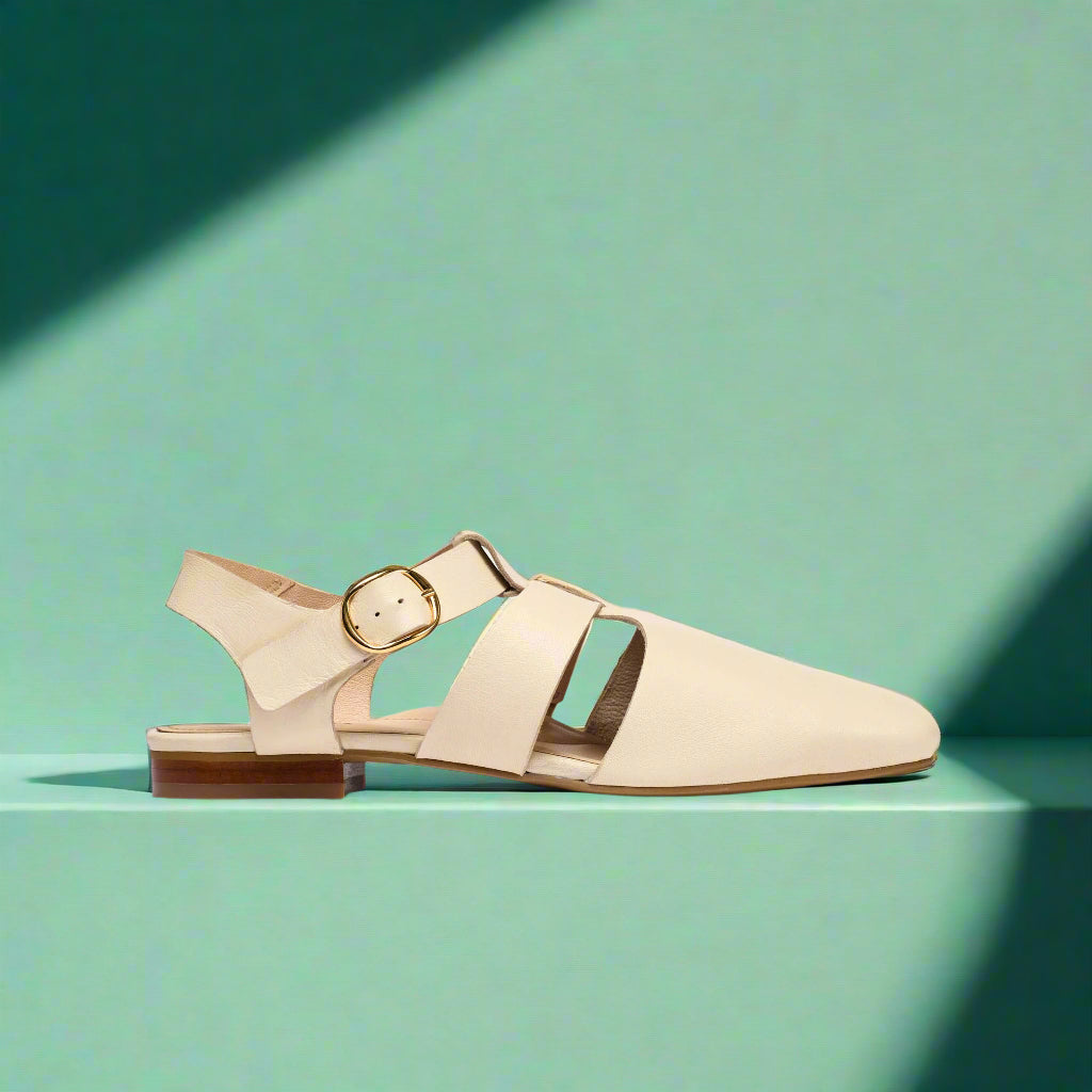 side view of off white sandals for bunions