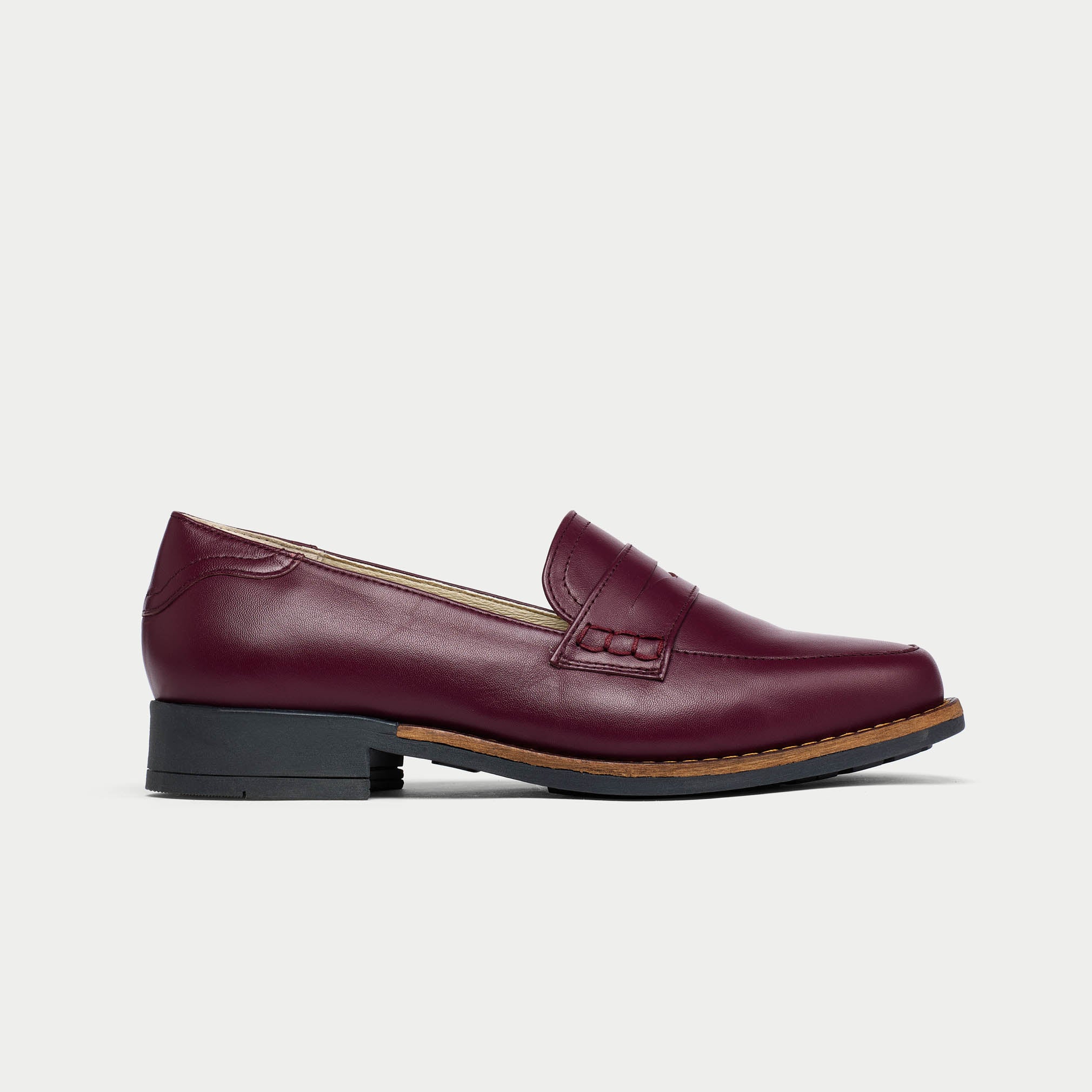 Nadia cherry loafer shoe on a light gray background side view