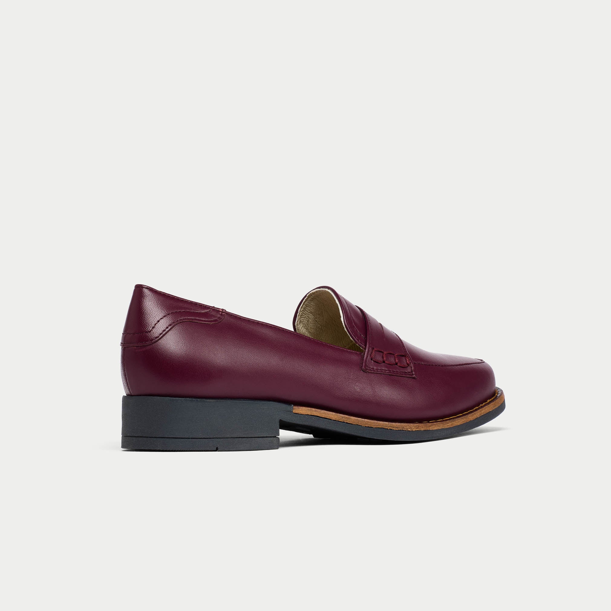 Nadia cherry loafer shoe on a light gray background