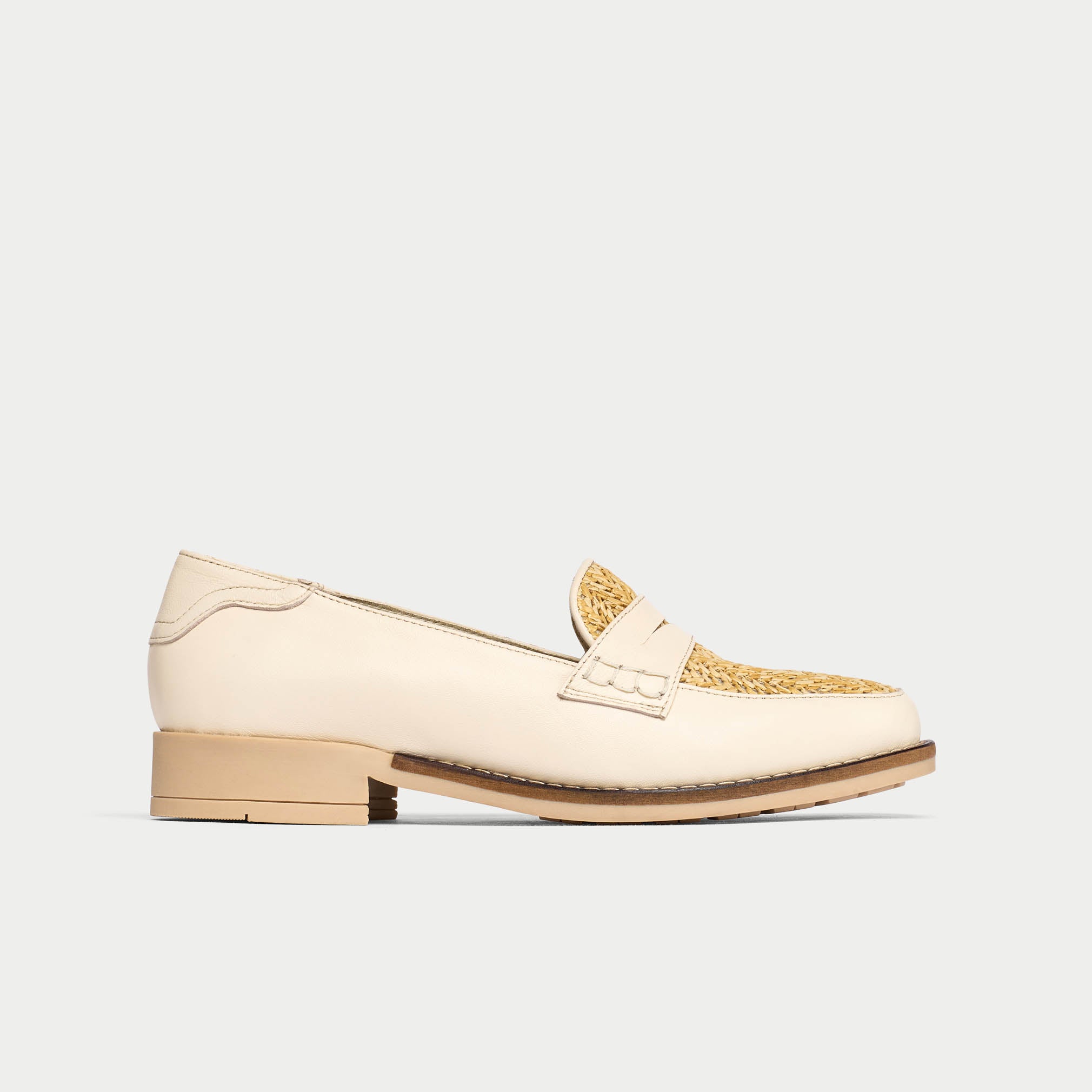 Beige loafer shoe on a light gray background