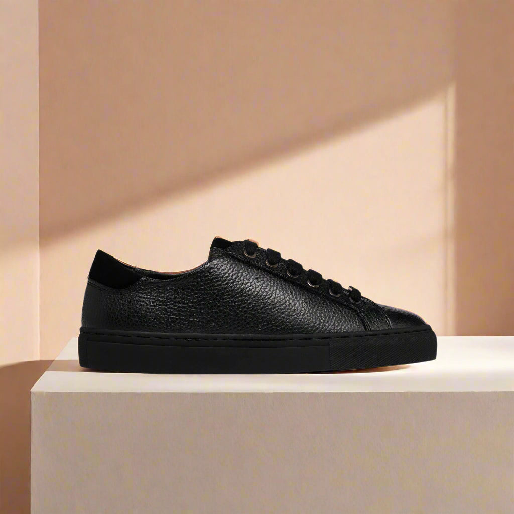 Star black leather sneaker side view