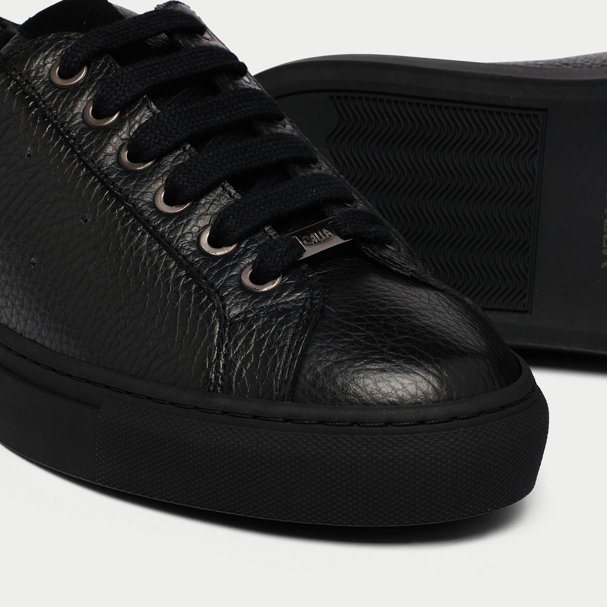 Star black leather sneaker tip view