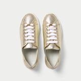 top view of a pair of gold trainers for bunions