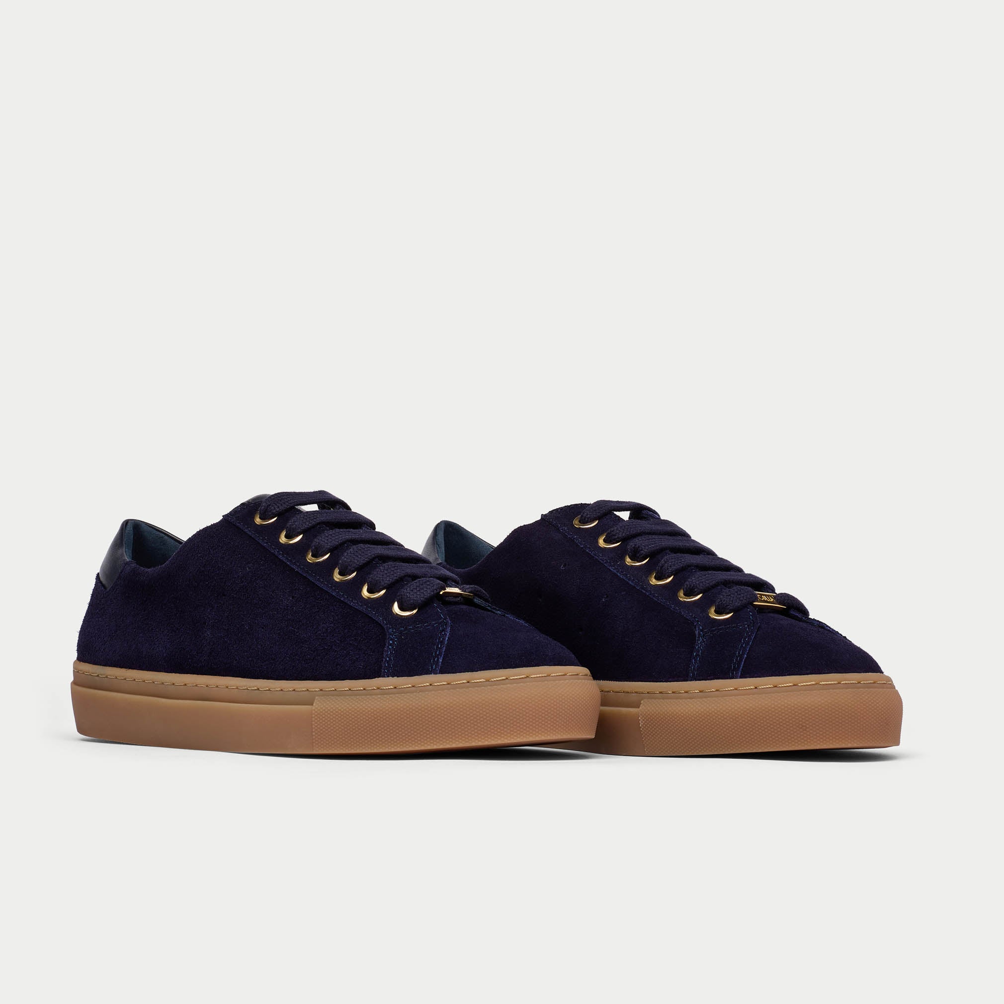 navy suede pair of sneakers