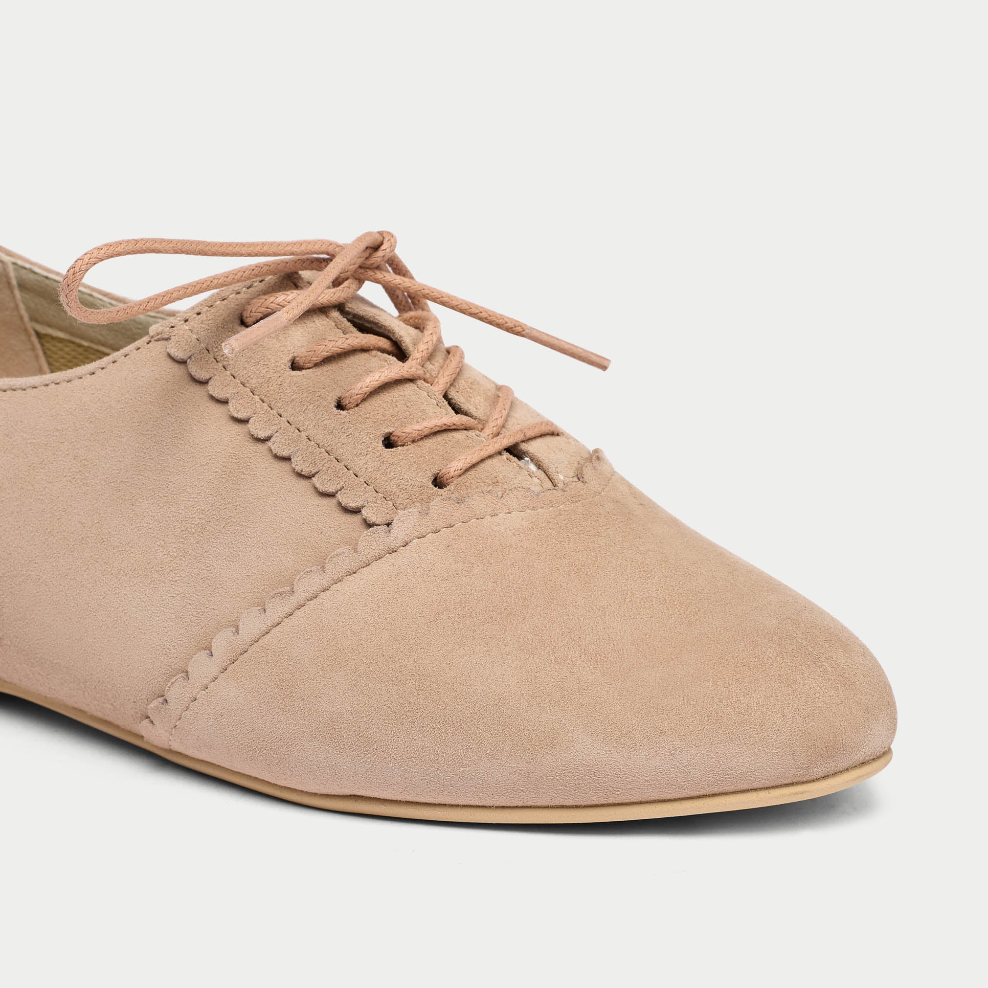 close up of nutmeg suede flats