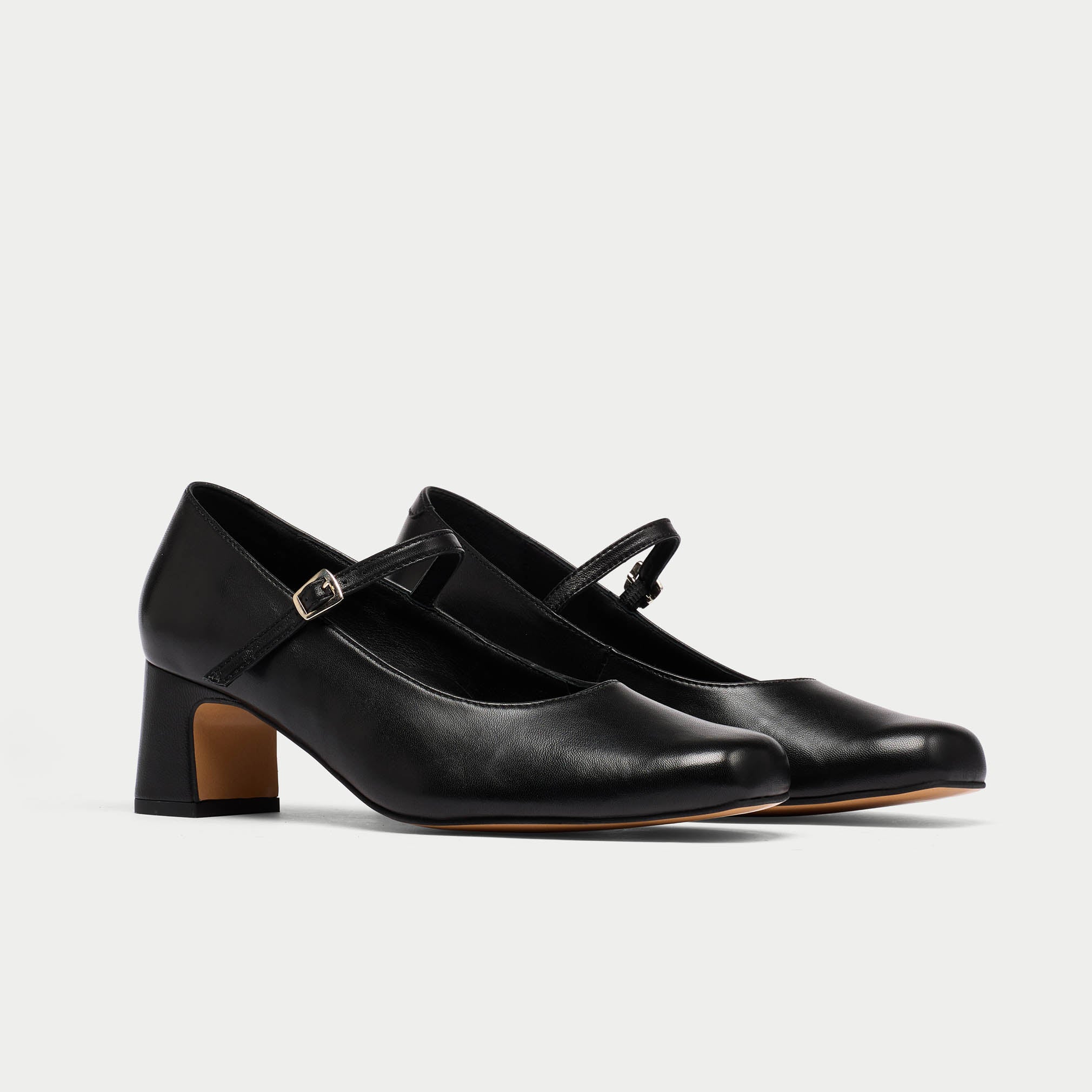 black leather mary janes pair