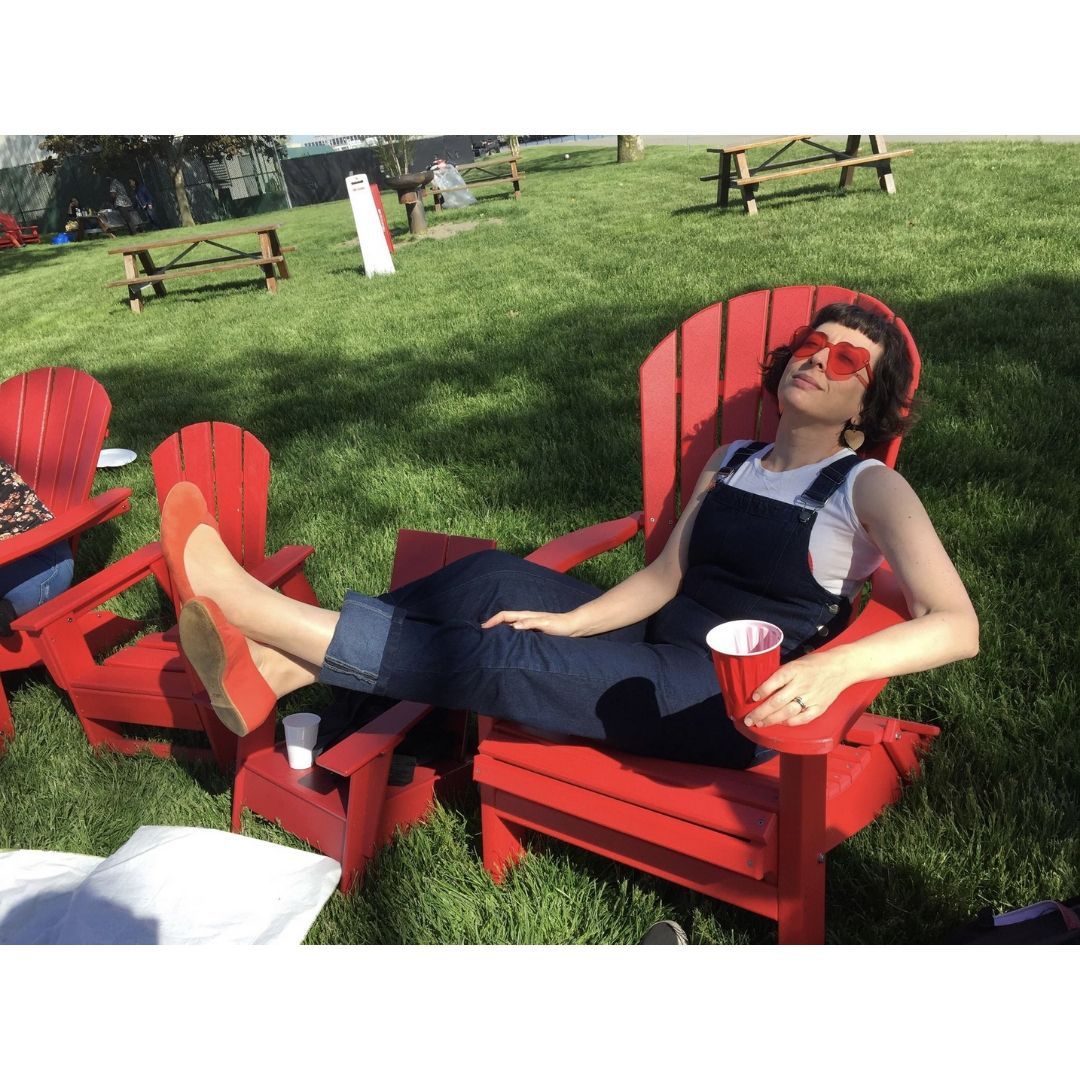 woman sitting on a deck chair