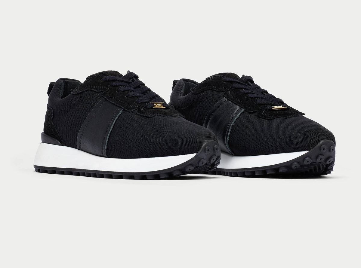A pair of Calla Cosmos chunky-sole black trainers
