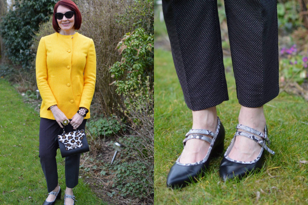 blogger stands in garden posing