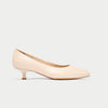 Nude-colored kitten heel shoe on a light gray background