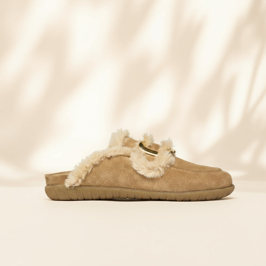 Beige slipper with white fur trim on a brown background