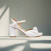 Lizzie white heels side view