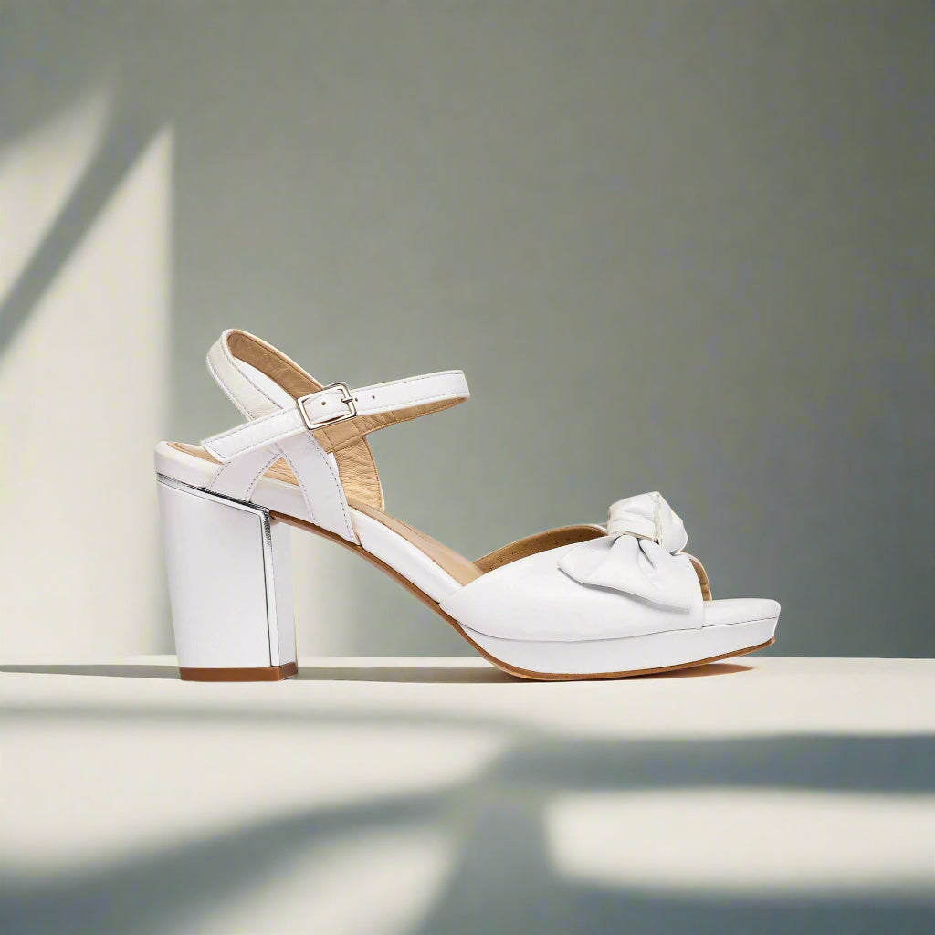 Lizzie white heels side view