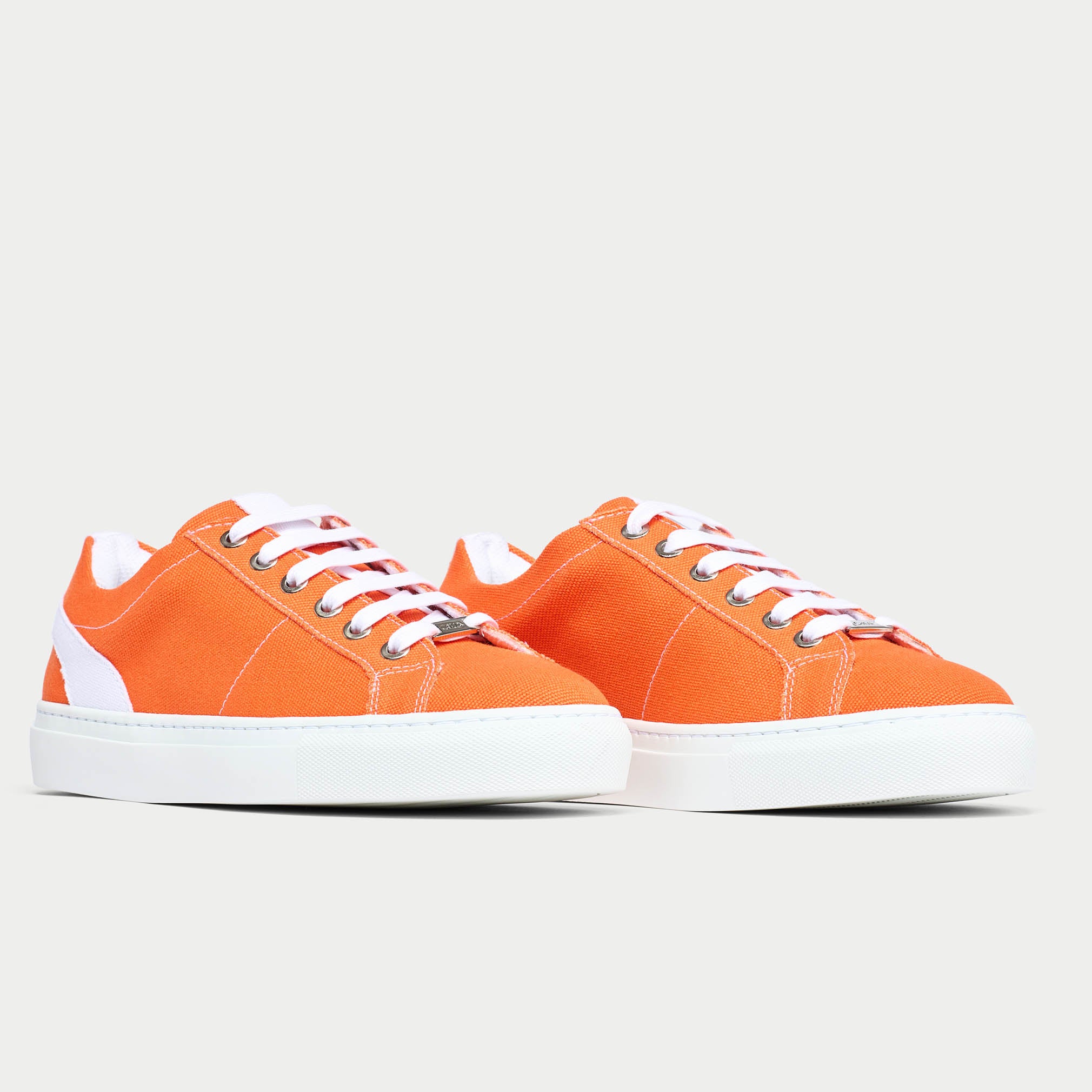 Luna orange trainer shoe pair