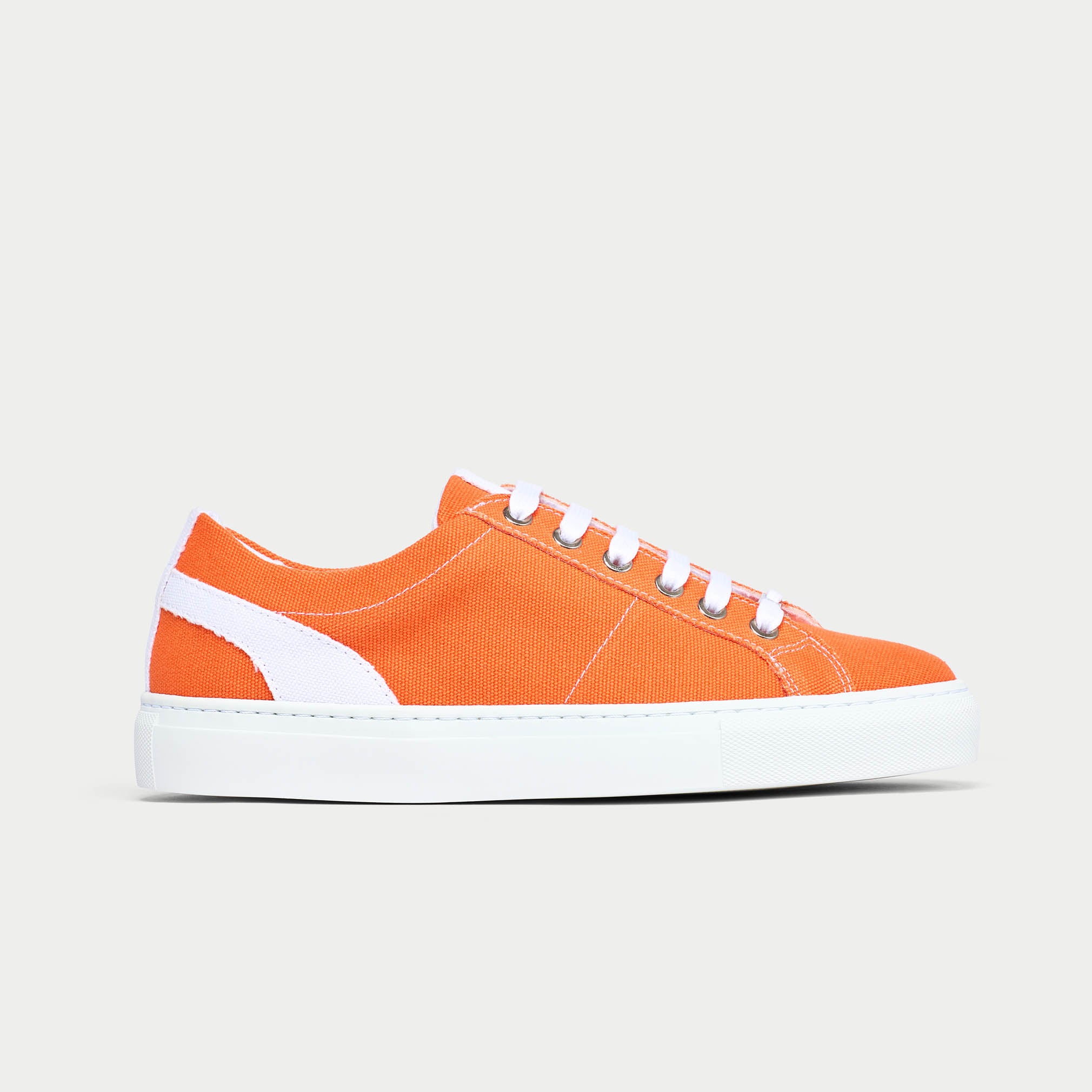 Luna orange trainer shoe side view