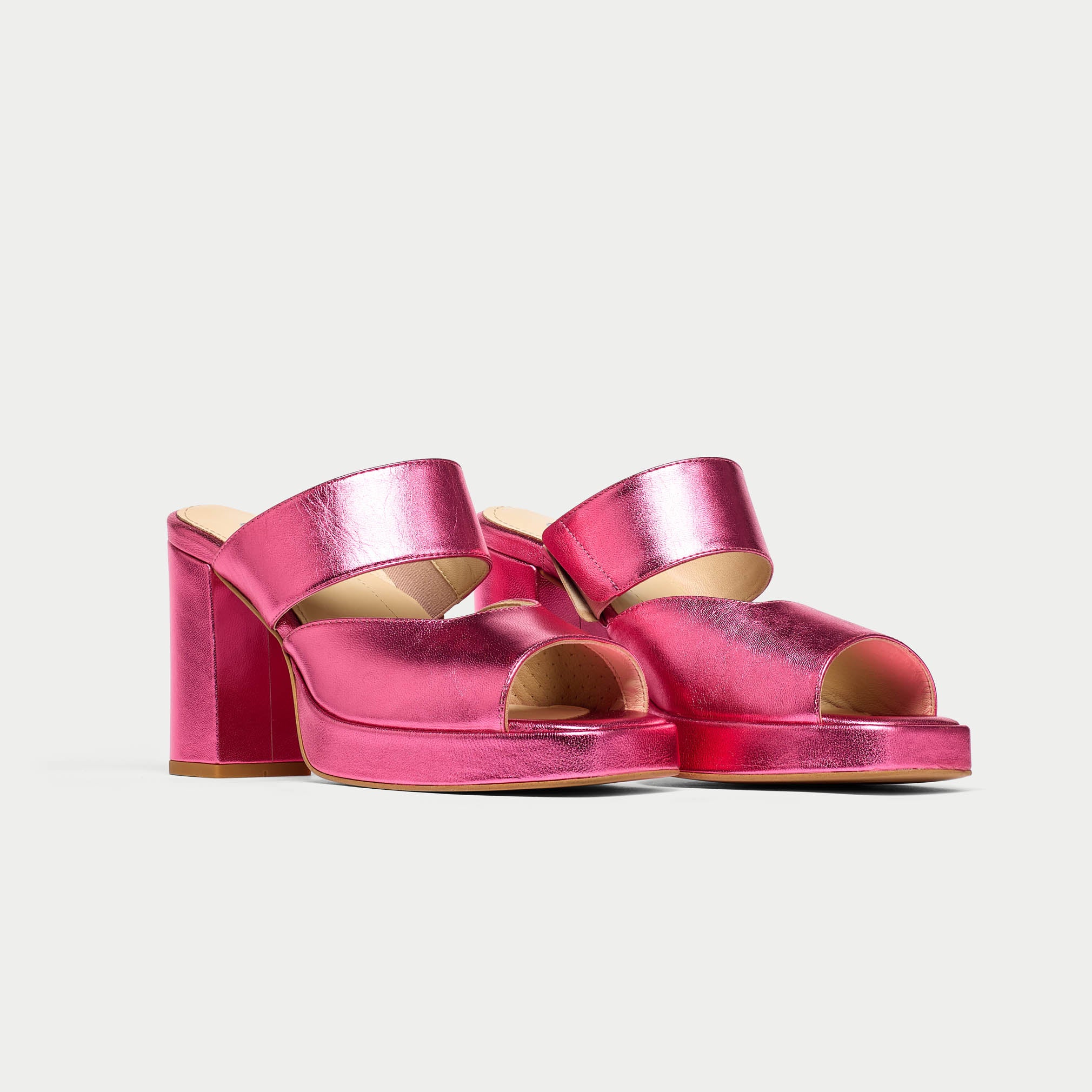 pair of metallic pink heels