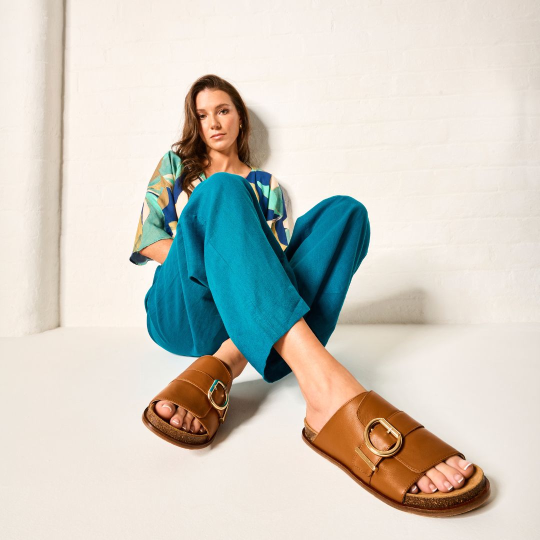 model wearing tan sandals