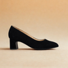 black block heels on light orange background