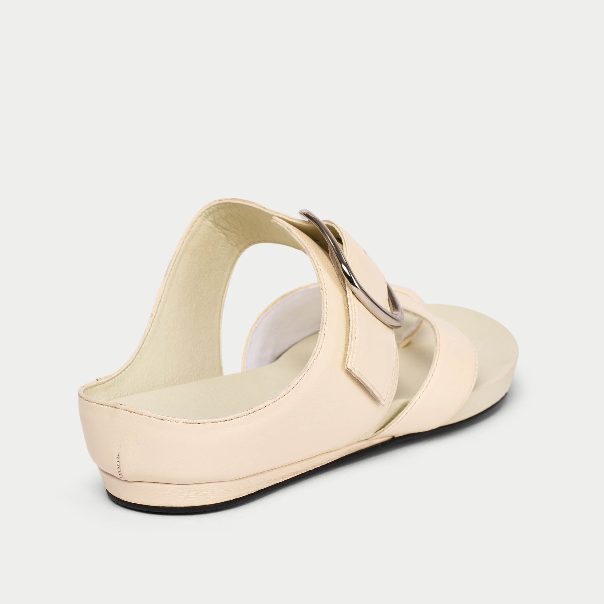 Beige sandal with a strap on a light gray background
