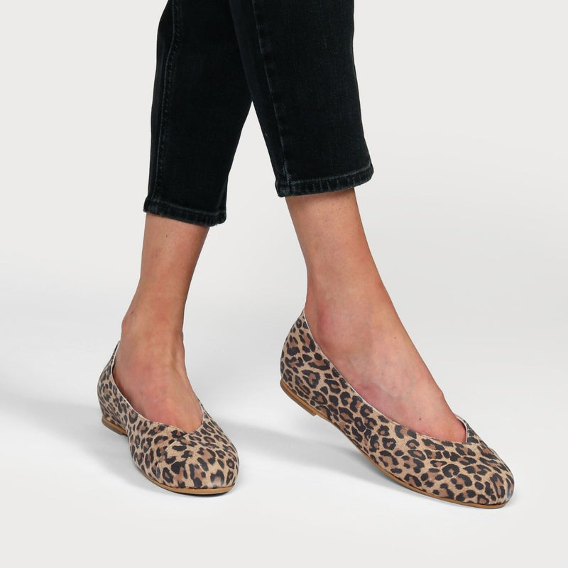 leopard print flats worn on feet