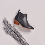 dark grey leather boots on side
