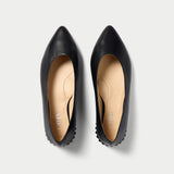 black leather ballet flats top view