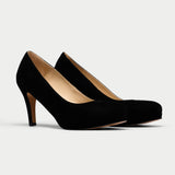 pair of black suede heels 